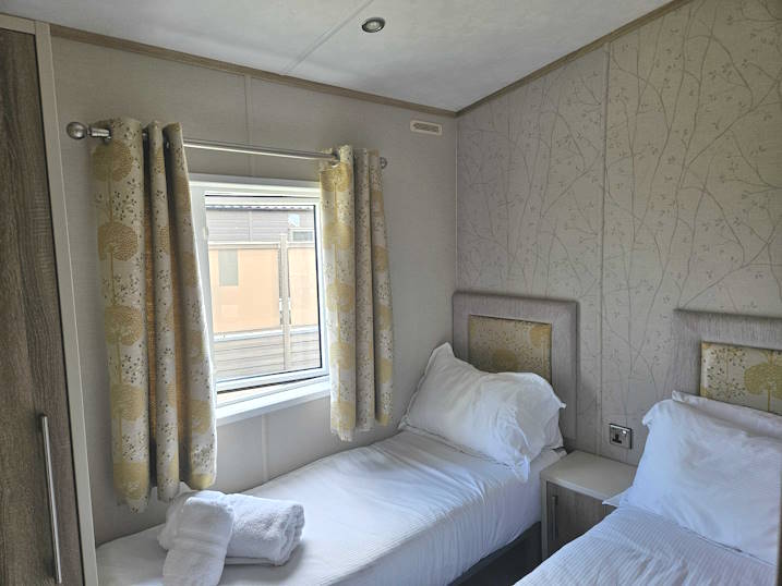 Twin bedroom, including wardrobe.